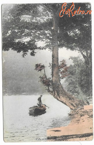 Япония - Японія.  View of Nikko - чоловік на човні.
